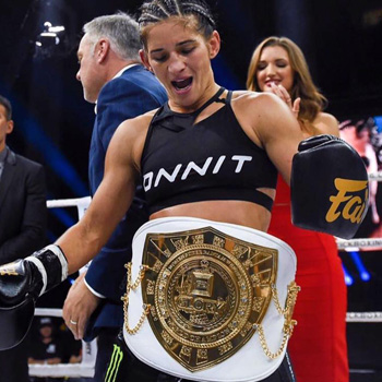 Tiffany "Timebomb" Van Soest wears the Glory Champion belt in the ring.